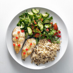 plate of healthy food, Fried trout. Wild whole grain rice porridge and salad.
