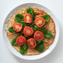 plate of healthy food Oatmeal pancake with greens and vegetables.