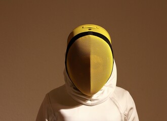 Fencer in a yellow mask.