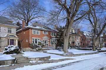 Street of traditional middle class single family houses on a sunny day in winter