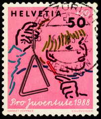 Child playing triangle