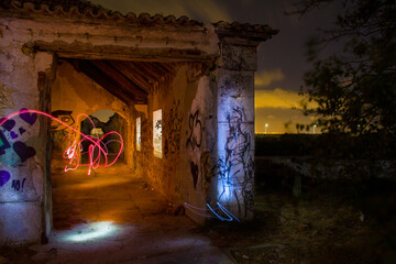 Abandoned house with graffitti and light painting