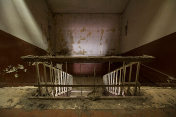 Abandoned stairwell full of dust