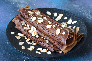 Delicious pancakes for breakfast with fruit and chocolate