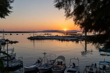 Nea Chora marina beach in Chania, Crete, Greece. Traditional greek tavern by the sea. Boats...
