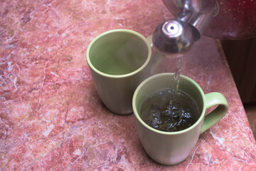 brewing tea in a cup