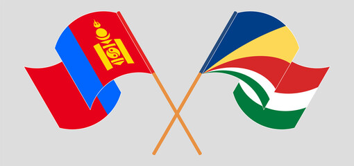 Crossed and waving flags of Mongolia and Seychelles