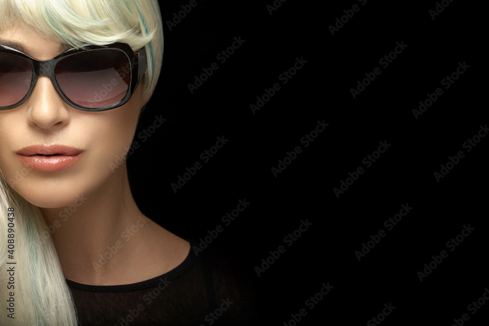 Wall mural beautiful blond woman in sunglasses