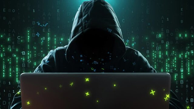 The hacker is sitting at his laptop. Electronic cyber attack