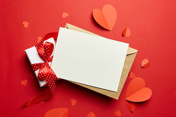 Valentines day card mockup with paper hearts on red background