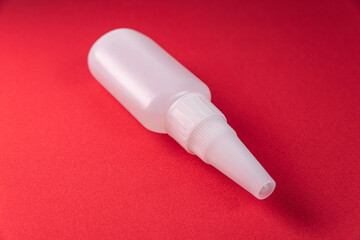 Glue bottle on the colorful background