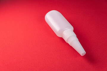 Glue bottle on the colorful background