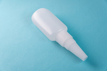 Glue bottle on the colorful background