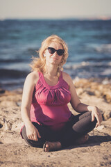 Fototapeta na wymiar Portrait of beautiful pregnant woman at beach. Toned