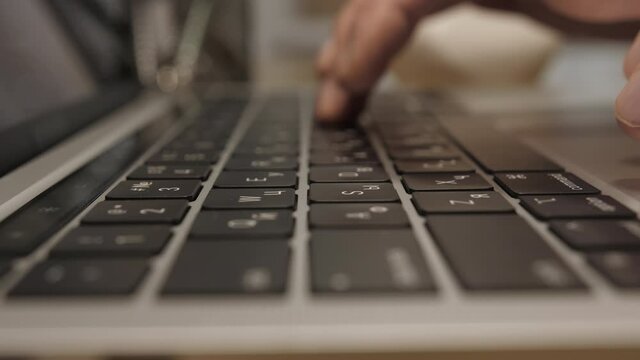 Notebook lying on the Tablet, Bright Sunny day in the Background Close-up Moving Macro Shot: Person Typing on the Computer Keyboard.Working, Writing Emails, Using Internet. . High quality 4k footage