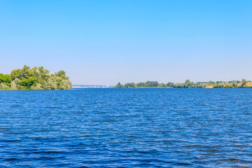 Fototapeta na wymiar Summer landscape with beautiful river, green trees and blue sky
