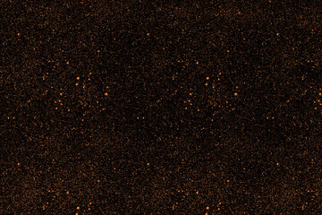 Black stylish background with a huge amount of gold dust particles, sparkles. A fashionable base for your projects.