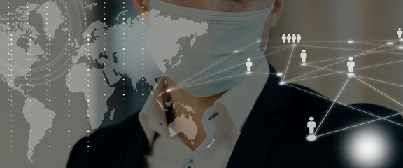 The concept of coronavirus between people in the world and business. Global business network and world map. male businessman background. A masked man working in a business center. remote work