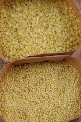 Millet and millet flakes in paper bags, gluten free healthy grains