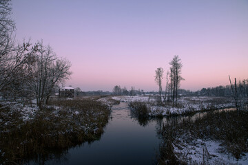 Fototapeta na wymiar Winter landscape on the river at dusk.