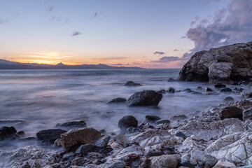 Beautiful sunset over the sea and stone beach of Farinole, Corsica