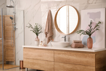 Modern bathroom interior with stylish mirror and vessel sink