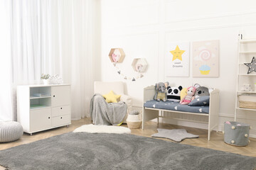 Child room interior with toys and stylish furniture