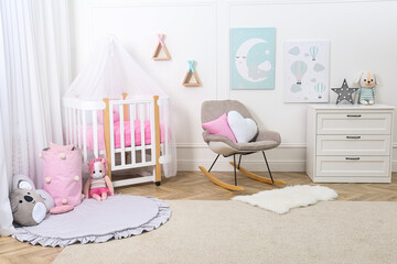 Baby room interior with toys and stylish furniture