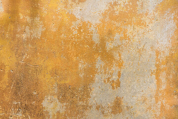 Old, grunge yellow cement, concrete or plaster wall with patterns and cracks. High quality texture and background for your projects and creative work