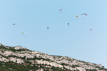 Paragliders over the mountains, Parque Natural da Arrábida, Setúbal, Portugal