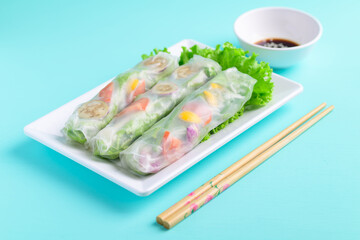Fresh vegetables spring roll eating with soy sauce and sesame, Asian Healthy Vegan food