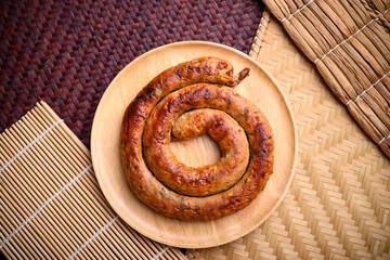 Northern Thai sausage (Sai Aua), Grilled intestine stuffed with minced pork, spices and herbs, popular food in Chiangmai, Thailand
