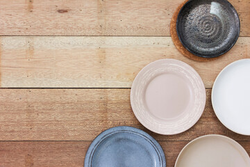 Plate to put food on it with wooden background.