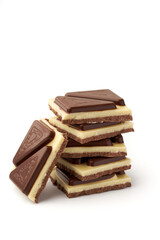 Stack of pieces of milk chocolate isolated on white background