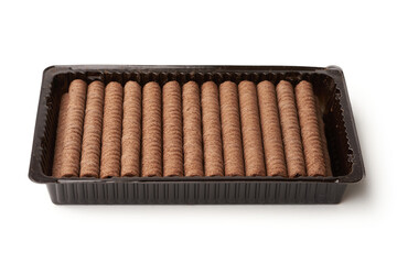 Crispy waffle sticks with cream in a package isolated on white background