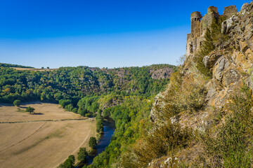 Fototapeta na wymiar View on the ruins of Chateau Rocher, an 11th century castle that stands over the Sioule river gorge