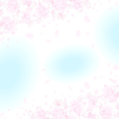 ぼんやりとした春の青い空　桜の枝のシルエットと花びらのフレーム