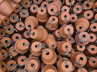 Many keychains are made from small brown plant pots