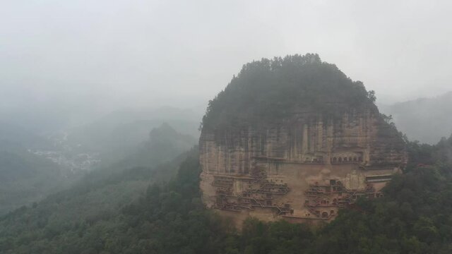 aerial view of maiji mountain grottoes in mist, world cultural heritage in tianshui city, gansu province, China.