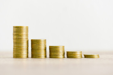 Golden coins stack on wooden table background, stack of coins financial growth ladder and business