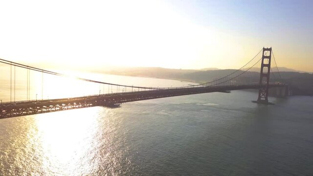 Beautiful Sunrise over San Francisco and the Golden Gate Bridge. Very unique and rare drone aerial footage of California's iconic bridge over the bay.