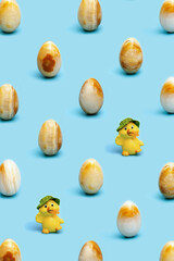 Decorative Easter egg made from Natural gemstone onyx. Fashion spring holiday background. Minimal style still life.