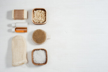 Spa still life background. Set for body care. Bottles with gel and shampoo, soap, sea salt, washcloth for bath.