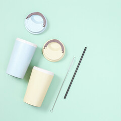 Reusable eco coffee cup and metal drinking straw. Zero waste concept