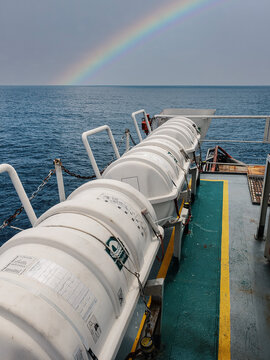 Liferafts on the deck of ocean offshore vessel. LSA life saving equipment. Ship is at sea
