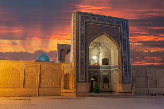 Kalan Mosque facade at Po-I-Kalan religious complex in Bukhara, Uzbekistan during sunset. Mosque iwan decorated at Poi Kalan. Kalon Mosque.