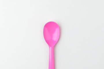 Plastic spoon on white background