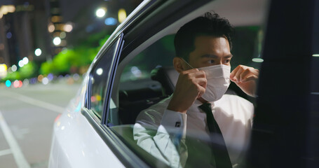 businessman wear mask in car