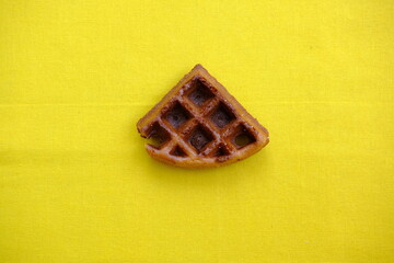 top view waffles on yellow background