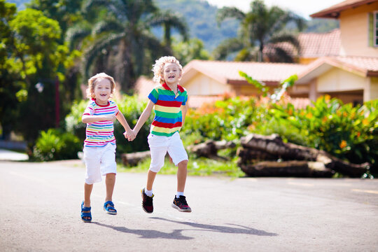 Kids running. Children run on city street.